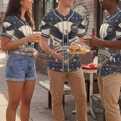 A diverse group of friends talking outdoors and enjoying fast food while wearing matching navy american eagle 250th anniversary baseball shirts.