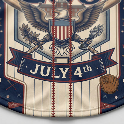 Extreme close-up of the lower front print on the navy jersey showing the detailed July 4th ribbon banner and a brown leather baseball glove icon.