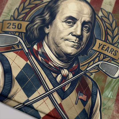 Detailed closeup of the Benjamin Franklin portrait and patriotic embroidery on polo fabric