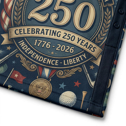 Closeup of navy 250th Anniversary commemorative graphic on golf shirt