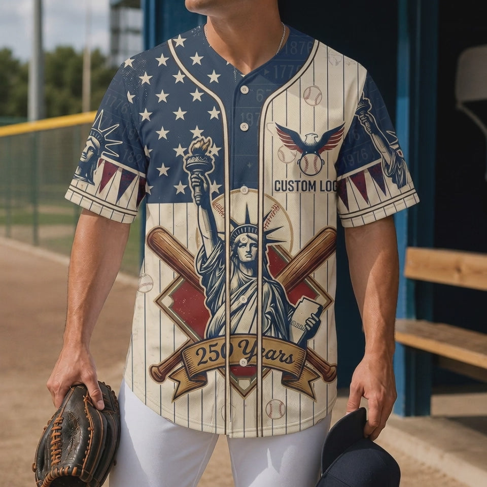 Short product preview showing a male model wearing the cream pinstripe Statue of Liberty USA anniversary baseball jersey in a sunny dugout.