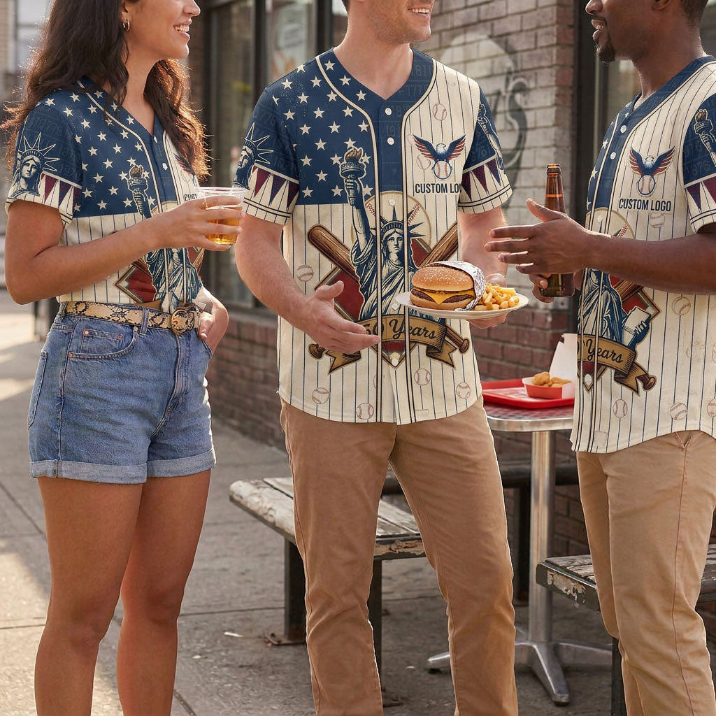 A diverse group of friends chatting outdoors and enjoying fast food while wearing matching cream pinstripe Statue of Liberty USA anniversary jerseys.
