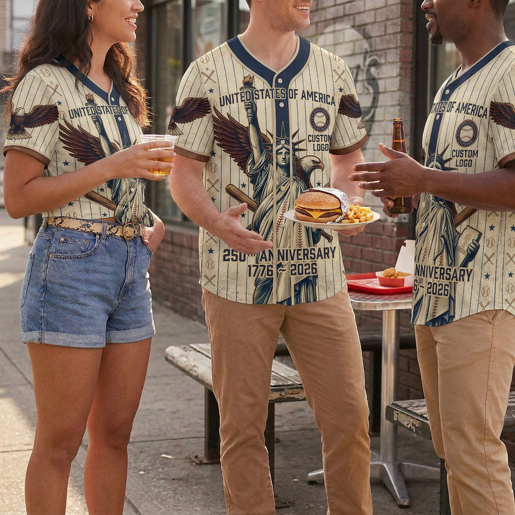 A diverse group of friends chatting outdoors and enjoying lunch while wearing matching cream pinstripe Statue of Liberty USA 250th anniversary jerseys.
