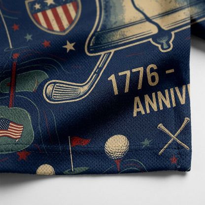 Close up detail of the golf polo displaying the high-definition Liberty Bell emblem, crossed clubs, and historical text.