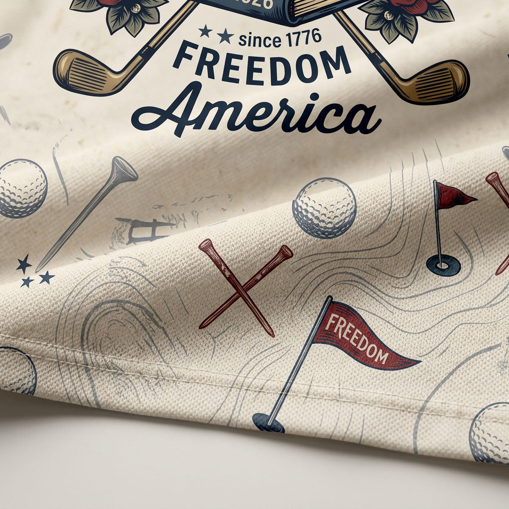 Close up detail of the golf polo displaying the vintage history books, Freedom America script, and crossed golf clubs artwork.