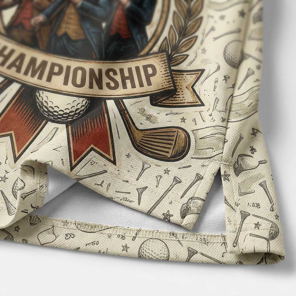 Close-up shot of the high-quality split hem and detailed golf doodle print reading Championship on a cream performance polo shirt.