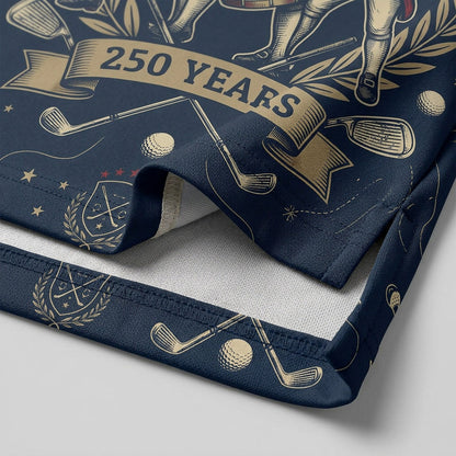Close-up shot of the high-definition printed historical revolutionary musicians emblem and crossed golf clubs on a premium polo shirt.